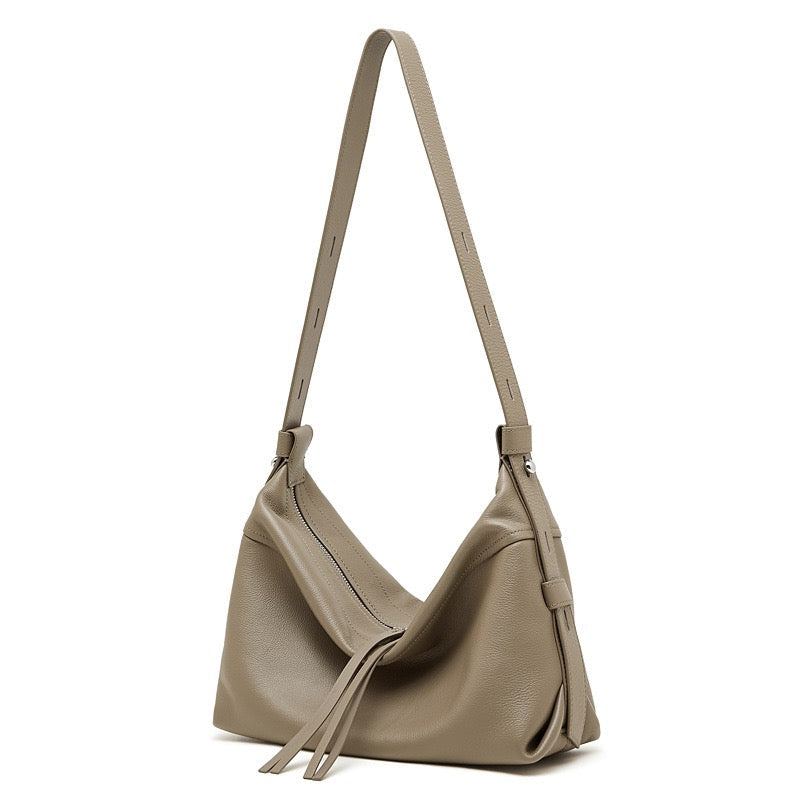 Women's Genuine Pebbled Leather Crescent Bag with Tassel Accent