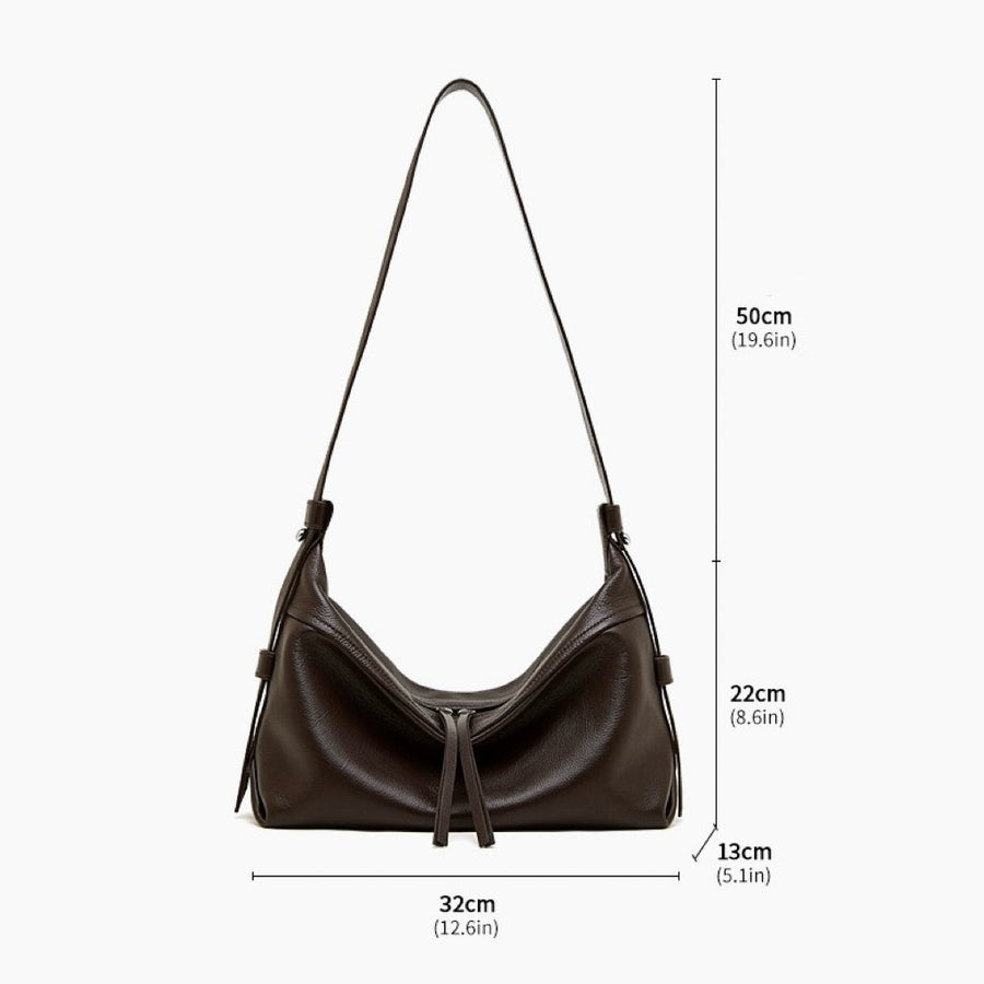 Women's Genuine Pebbled Leather Crescent Bag with Tassel Accent